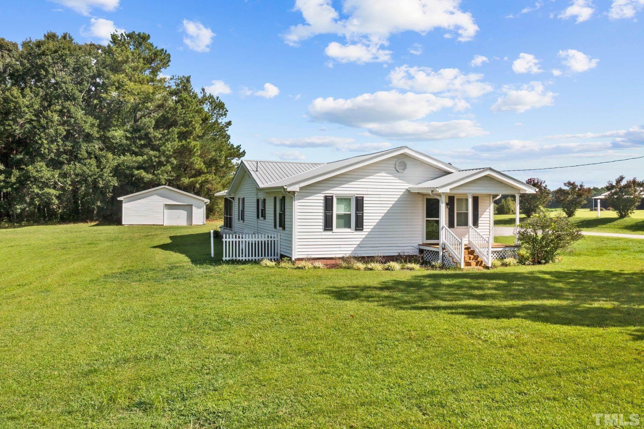 2929 Wall Store Road Garner, NC 27529 - Photo 36 of 59 a view of a house with a yard