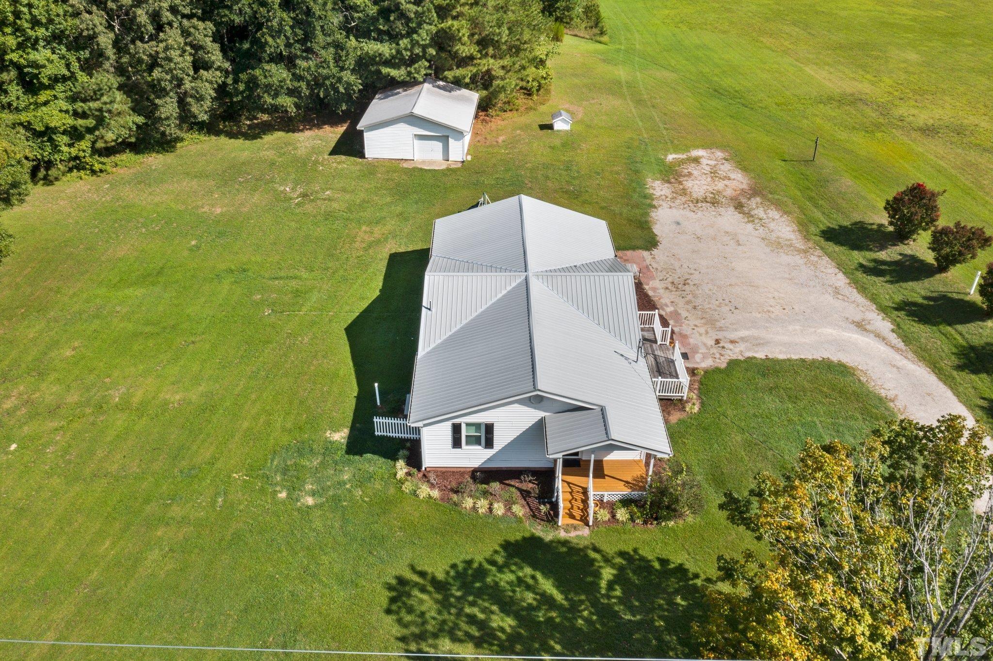 2929 Wall Store Road Garner, NC 27529 - Photo 4 of 59 an aerial view of a house with a yard basket ball court and outdoor seating