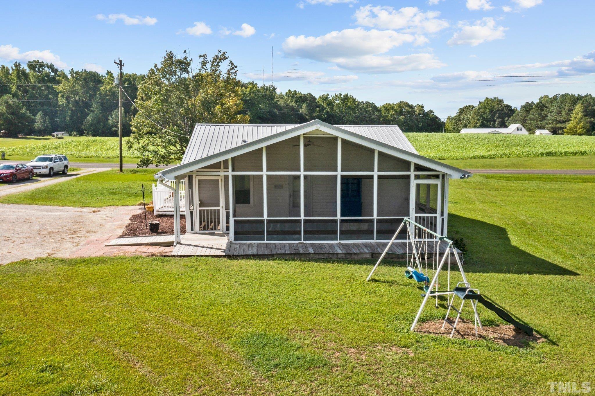 2929 Wall Store Road Garner, NC 27529 - Photo 41 of 59 a view of a house with a yard and sitting area