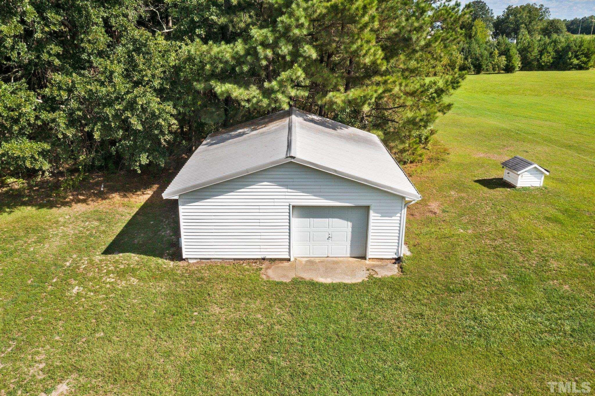 2929 Wall Store Road Garner, NC 27529 - Photo 49 of 59 a house view with a garden space