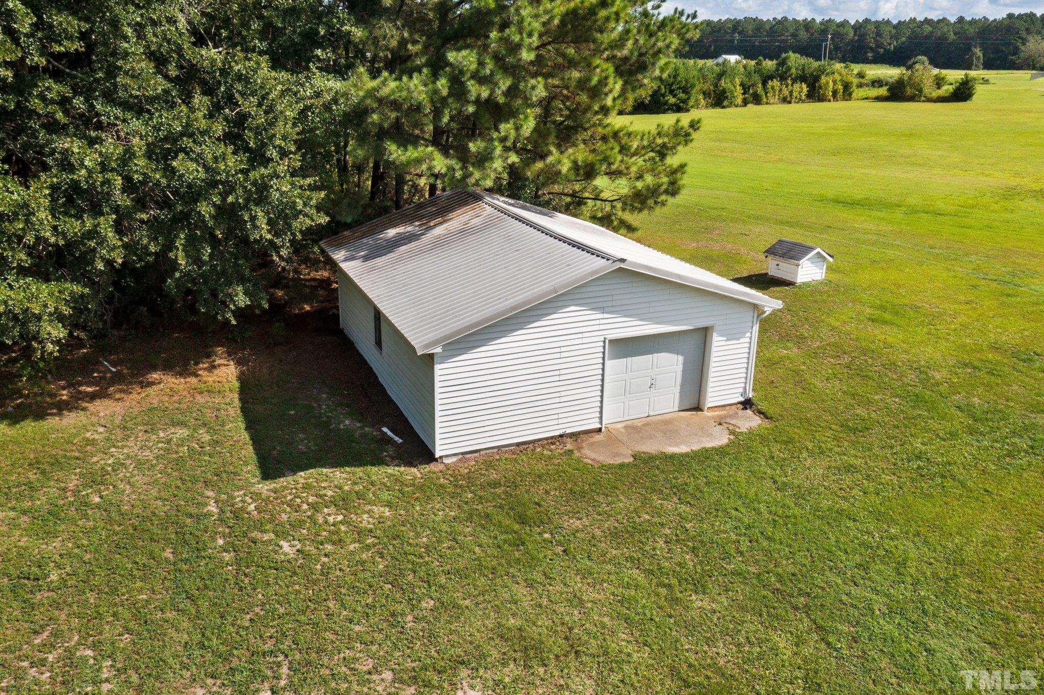 2929 Wall Store Road Garner, NC 27529 - Photo 50 of 59 a house with river in front of it