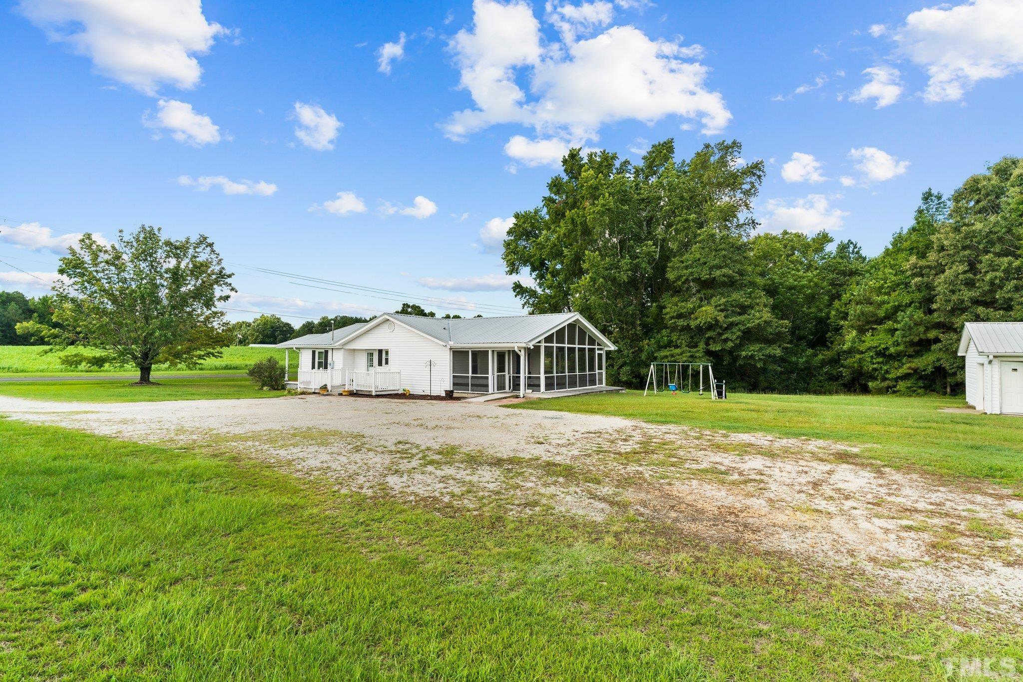2929 Wall Store Road Garner, NC 27529 - Photo 58 of 59 a front view of a house with garden