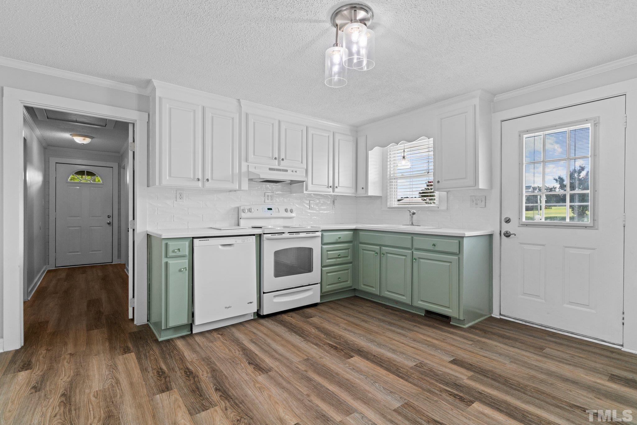 2929 Wall Store Road Garner, NC 27529 - Photo 6 of 59 a kitchen with a sink window and cabinets