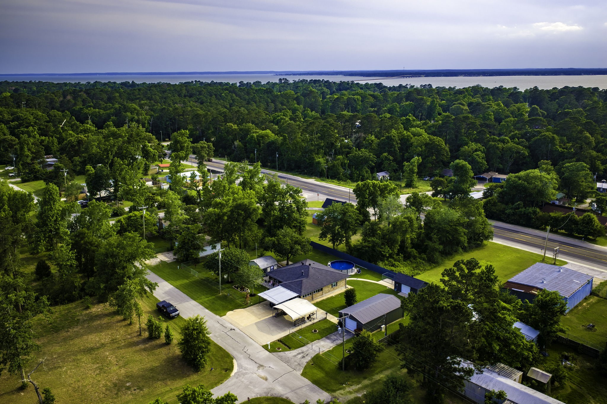 188 Huckleberry Road Onalaska, TX 77360 - Photo 43 of 49 a view of yard with swimming pool and outdoor seating
