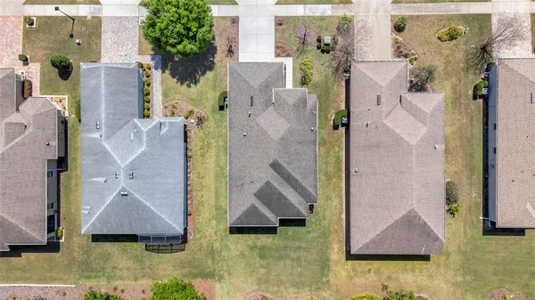an aerial view of a house with swimming pool