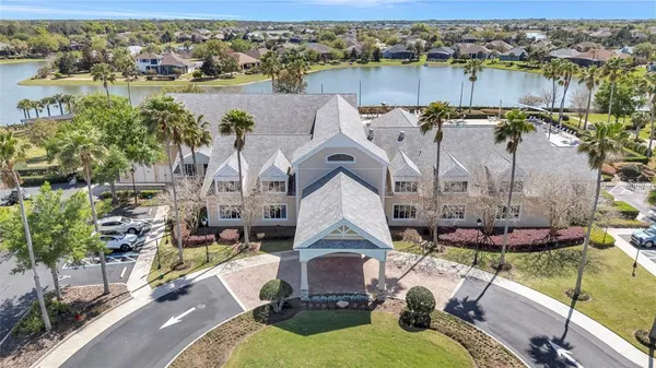 an aerial view of a house with a lake view