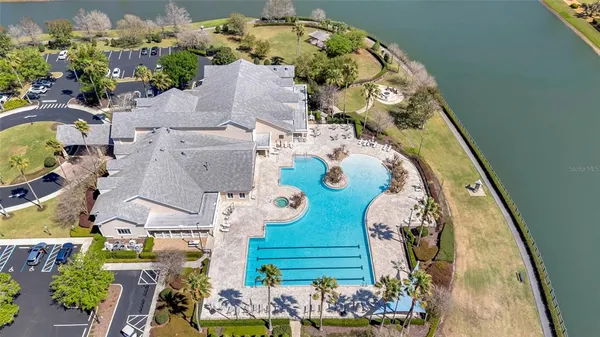 an aerial view of a residential houses with outdoor space