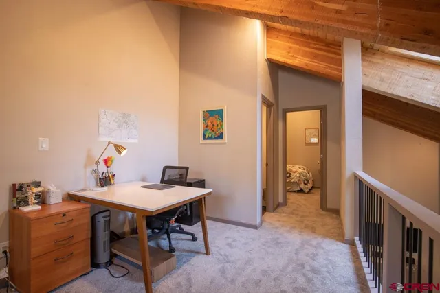 a view of a workspace with furniture