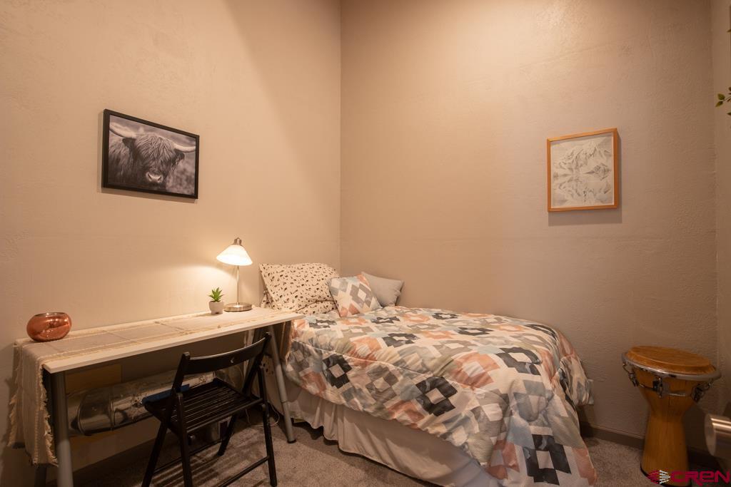 306 Hogan Circle Durango, CO 81301 - Photo 14 of 39 a bedroom with a bed and a table