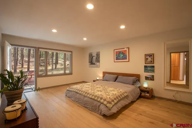 a bedroom with a large bed and a couch