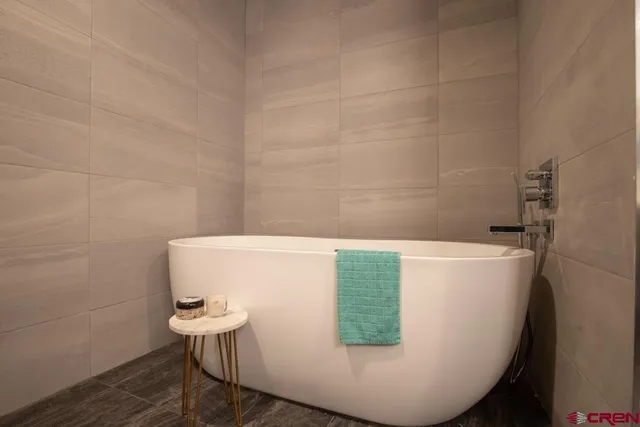 a view of a bath tub sitting in a bathroom