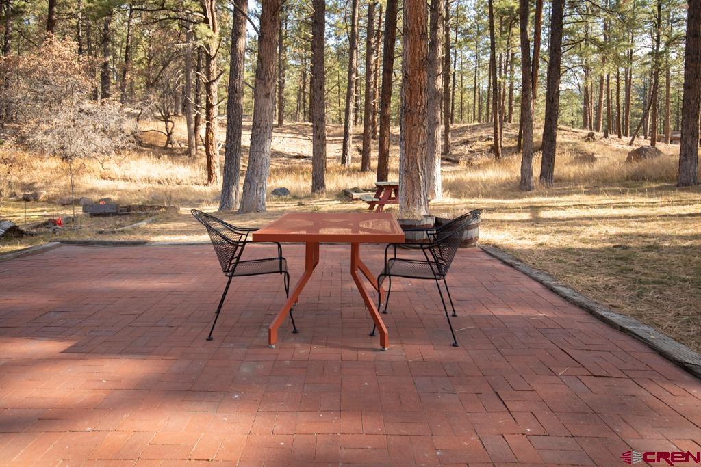 306 Hogan Circle Durango, CO 81301 - Photo 23 of 39 a view of a backyard with sitting area