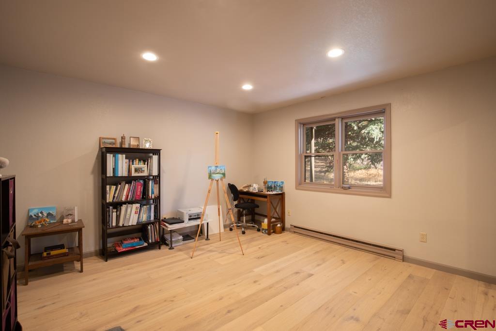 306 Hogan Circle Durango, CO 81301 - Photo 26 of 39 a view of a workspace with furniture and a book shelf