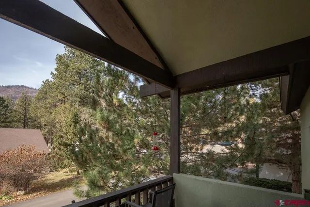 a view of a yard from a balcony