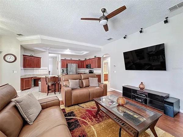 a bedroom with a bed lamp closet and large window