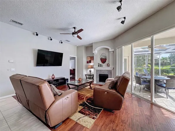 a bedroom with a bed and a flat tv screen on dresser