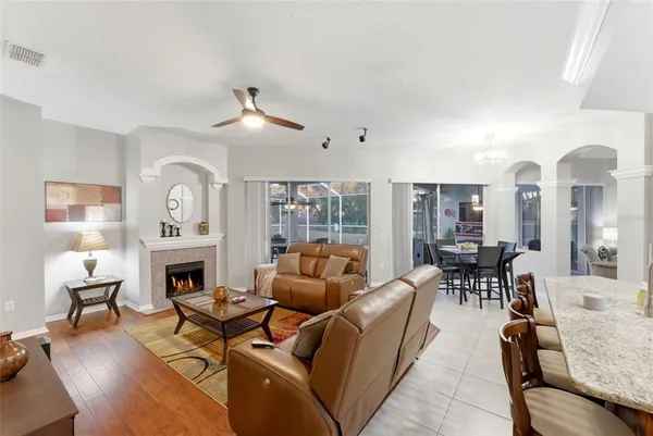 a bedroom with a bed a mirror and a table in it