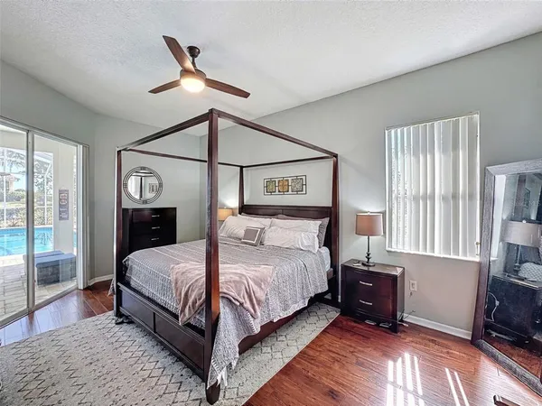 a bedroom with a bed and a lamp