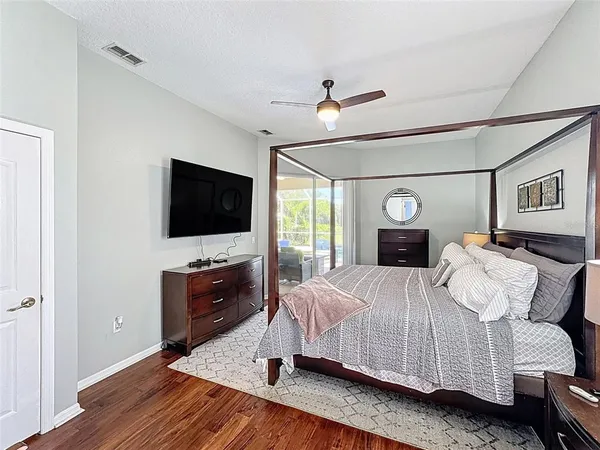 a living room with furniture and a floor to ceiling window