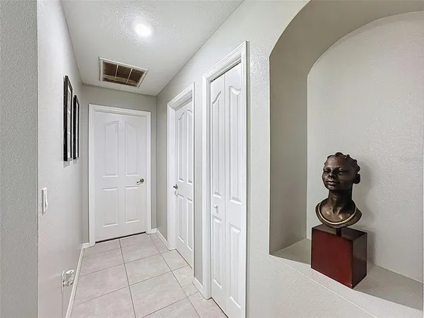 a living room with furniture a window and a bookshelf