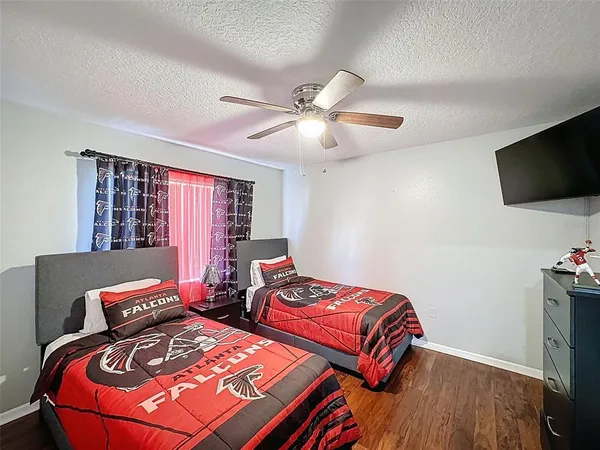a view of workspace with wooden floor and gym equipment