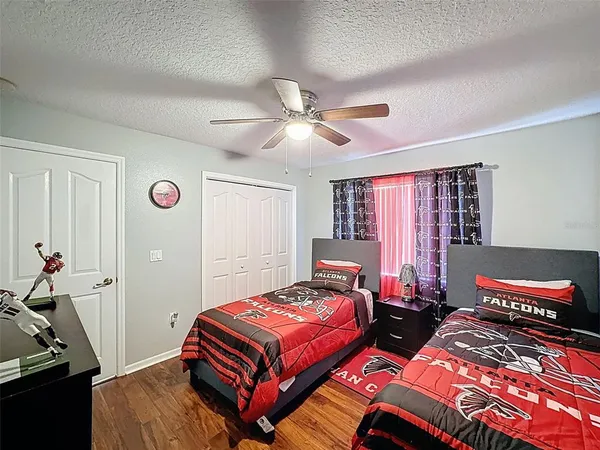 a living room with furniture a rug and a chandelier