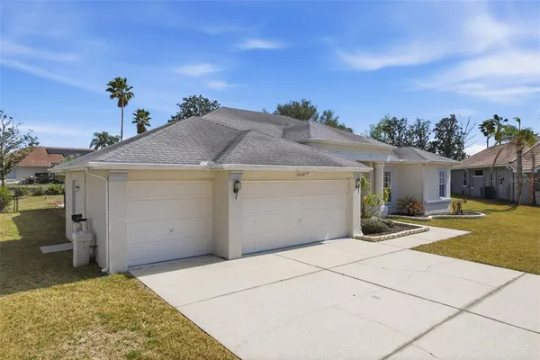 a view of a dining room with furniture wooden floor and a chandelier