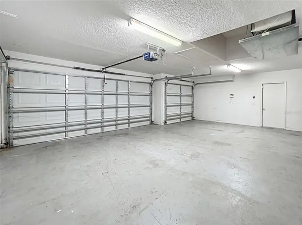 a view of a house with a yard and deck