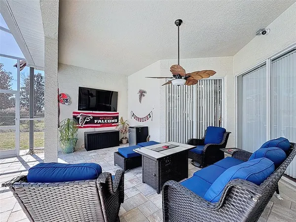 a view of a swimming pool with a patio