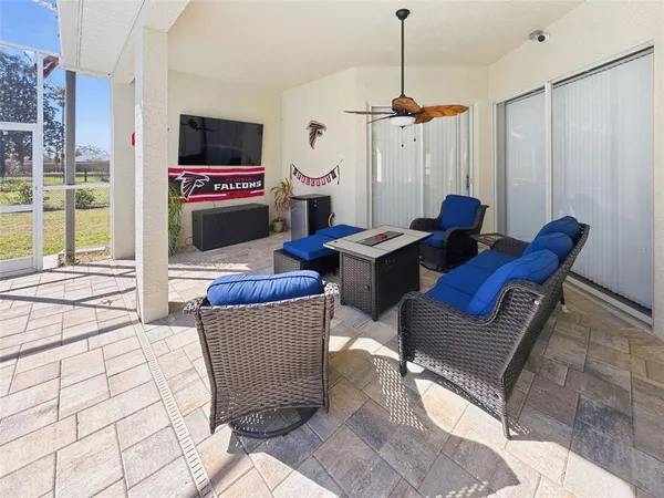 an aerial view of residential houses with outdoor space and ocean view