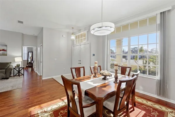 a view of a dining room with furniture and window