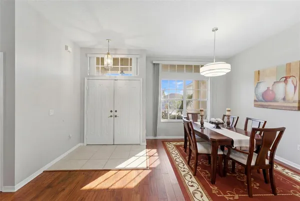 a living room with furniture and a book shelf