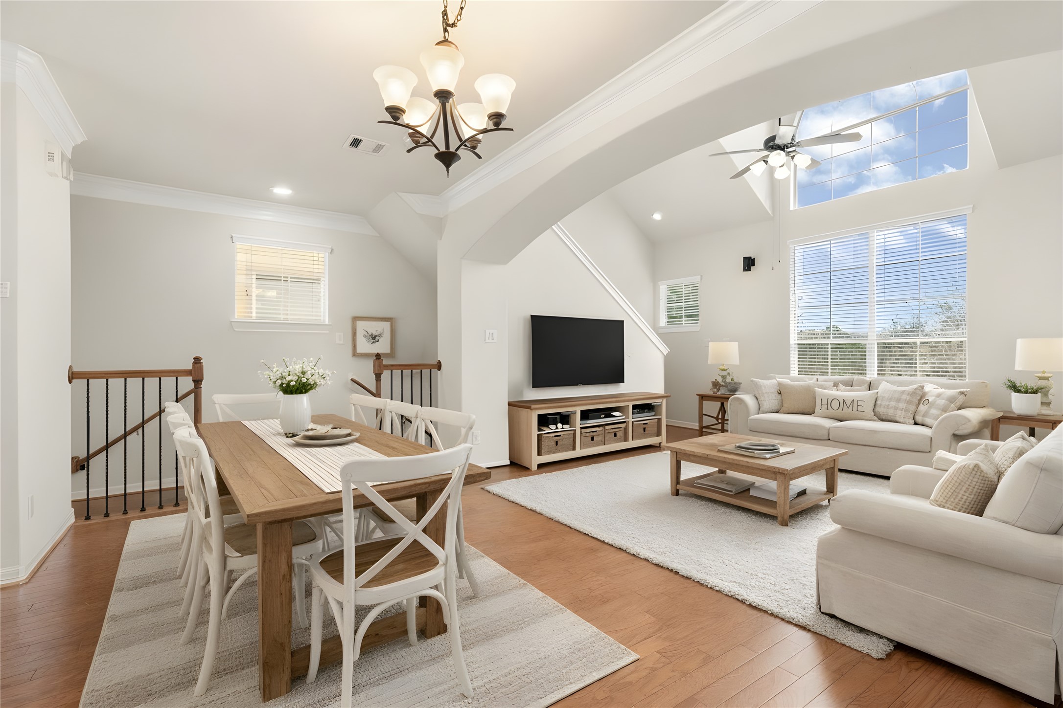 3334 Clearview Villa Way Houston, TX 77025 - Photo 5 of 35 Bright, open living space with hardwood floors, large windows, and high ceiling, Ideal for a modern, airy atmosphere. virtually staged dipicting the Open concept Living and Dining