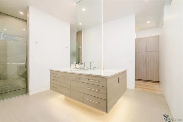 a bathroom with a double vanity sink mirror and double