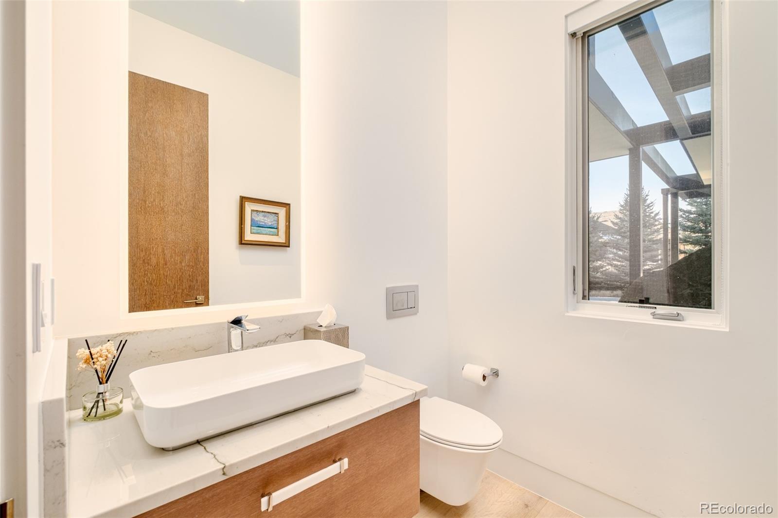 121 South Dexter Street Denver, CO 80246 - Photo 21 of 42 a bathroom with a sink and a mirror