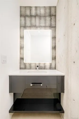 a view of room with a sink and a mirror