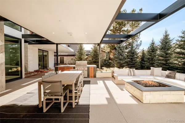 a view of a patio with table and chairs with wooden floor
