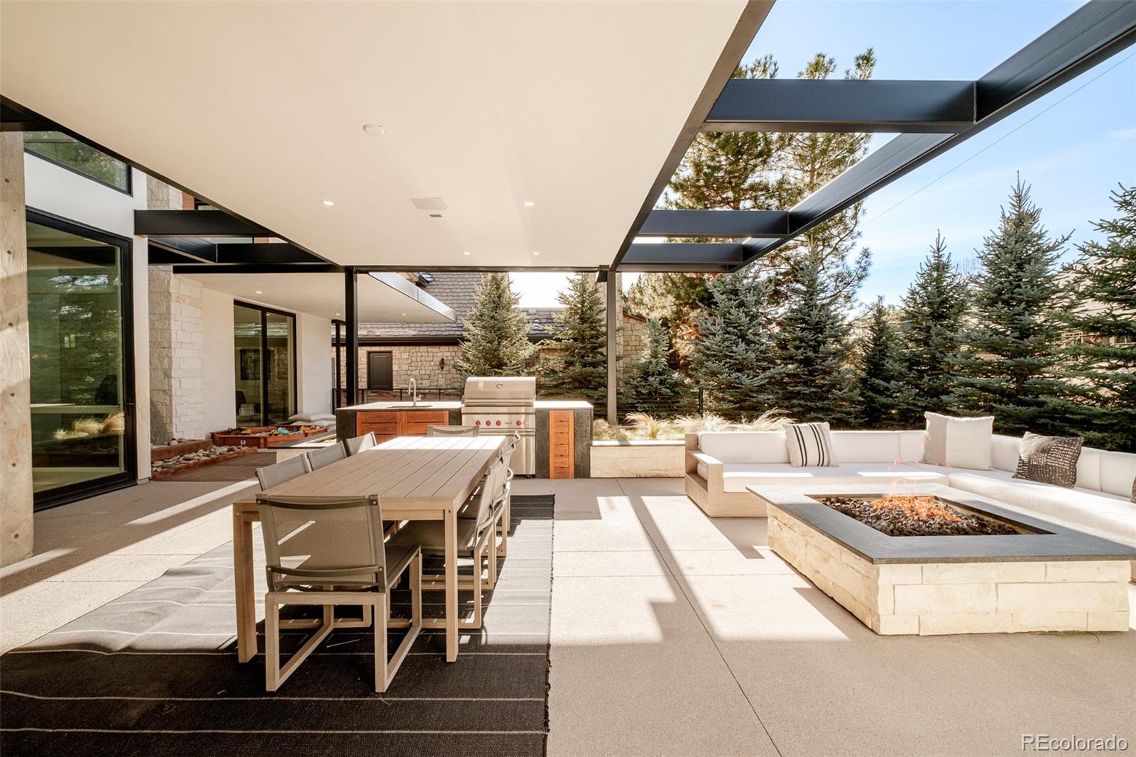 121 South Dexter Street Denver, CO 80246 - Photo 41 of 42 a view of a patio with table and chairs with wooden floor