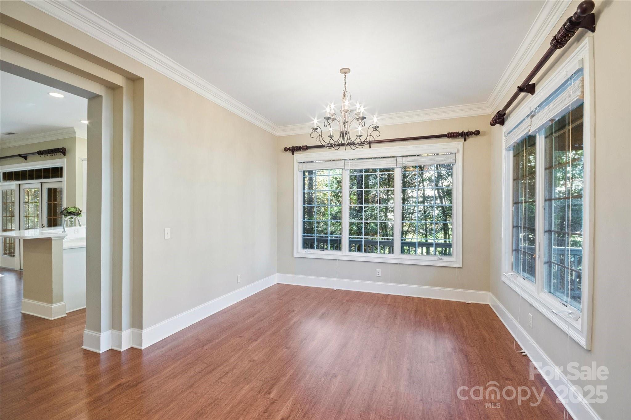 186 Camptown Road Brevard, NC 28712 - Photo 12 of 38 a view of an empty room with wooden floor and a window