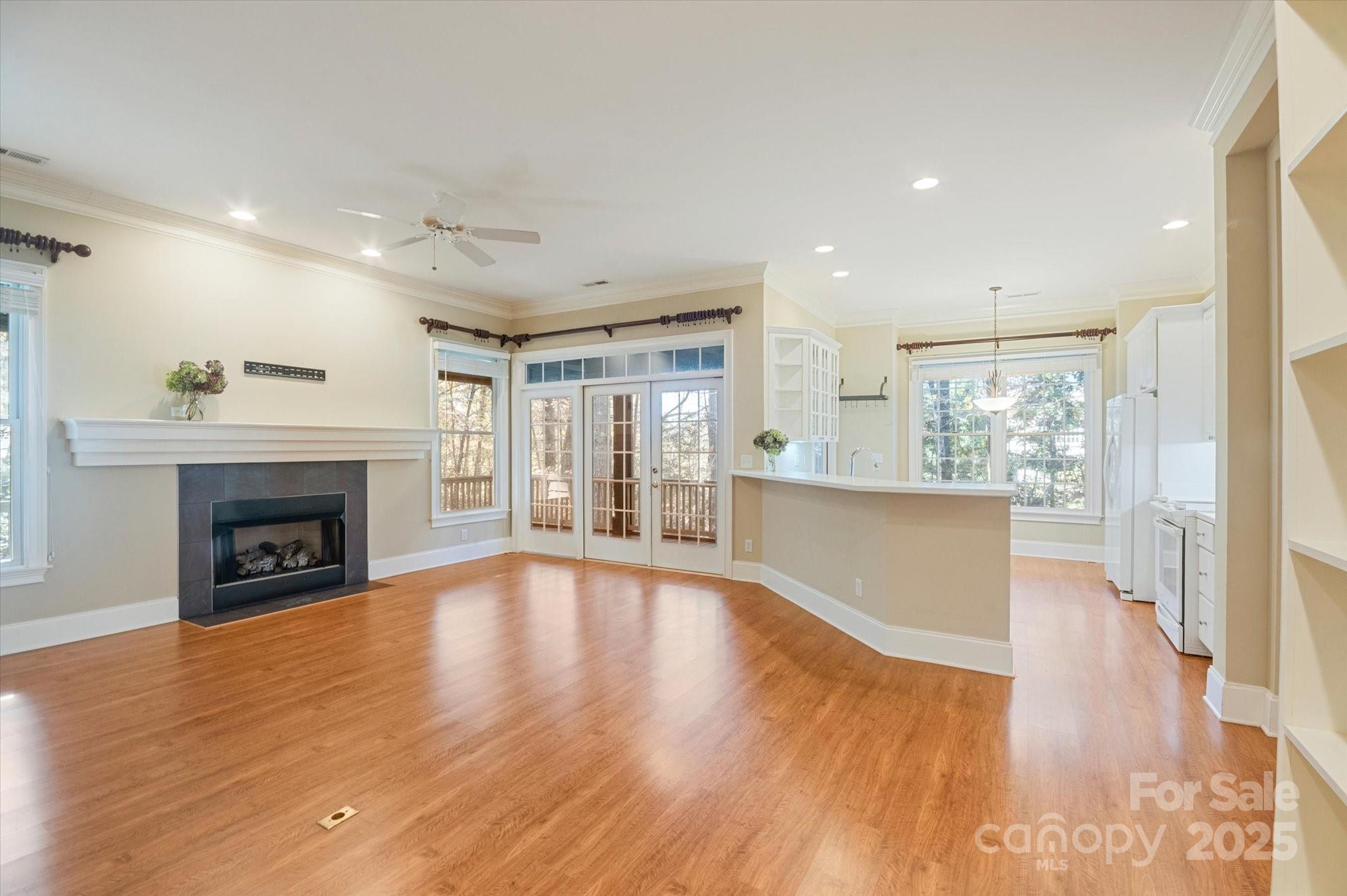 186 Camptown Road Brevard, NC 28712 - Photo 13 of 38 a view of an empty room with wooden floor and a fireplace