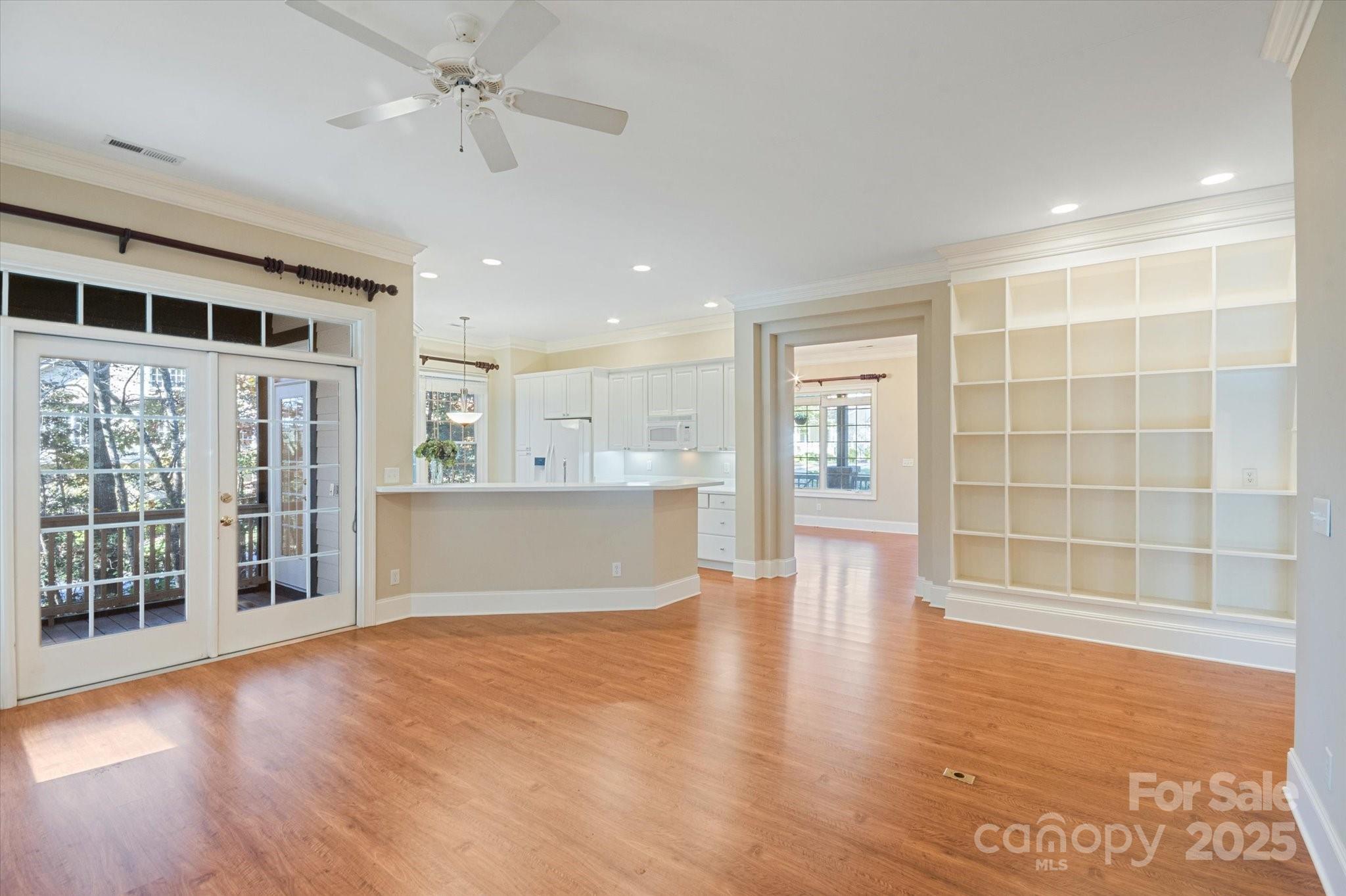 186 Camptown Road Brevard, NC 28712 - Photo 14 of 38 an empty room with wooden floor and windows