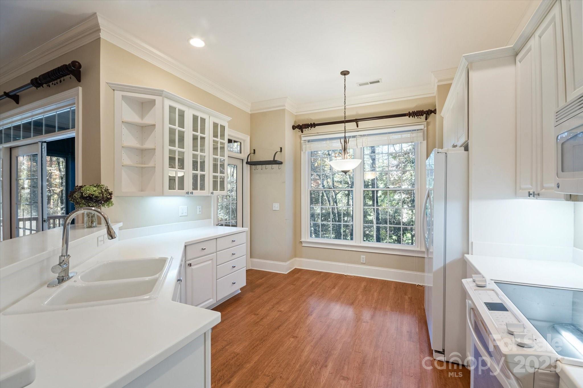 186 Camptown Road Brevard, NC 28712 - Photo 16 of 38 a spacious bathroom with a granite countertop sink mirror and a large window
