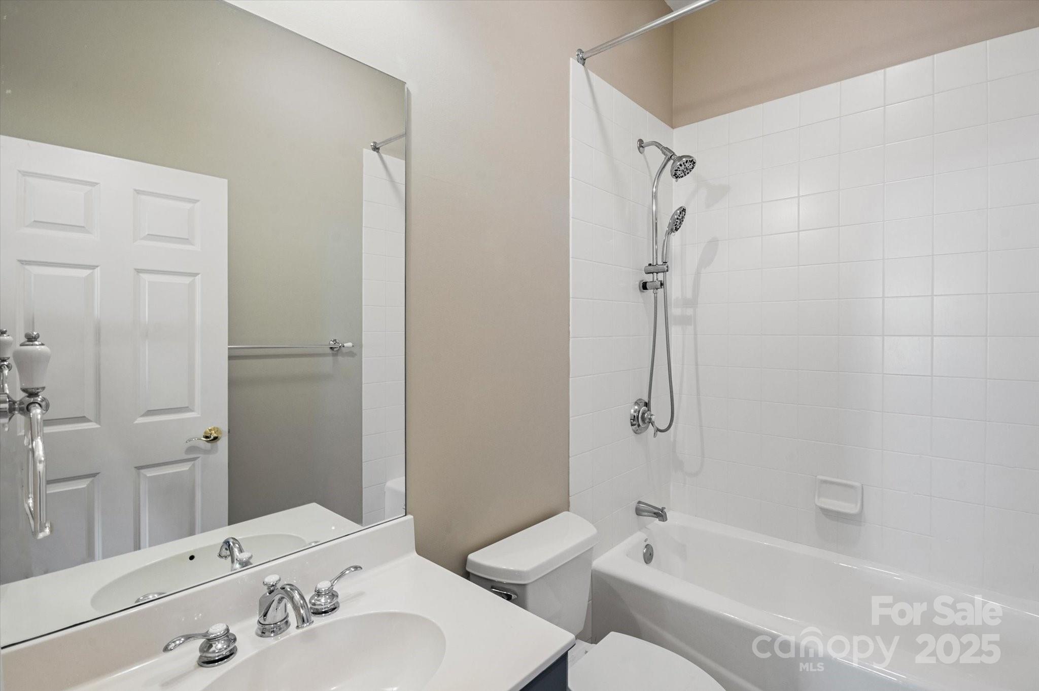 186 Camptown Road Brevard, NC 28712 - Photo 23 of 38 a bathroom with a bathtub shower sink vanity and toilet