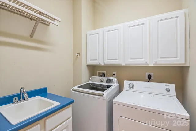 a view of storage and utility room with washer and dryer
