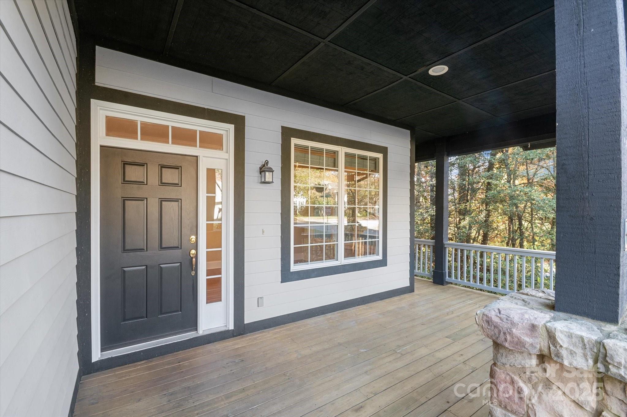 186 Camptown Road Brevard, NC 28712 - Photo 4 of 38 a view of an empty room with wooden floor and a window