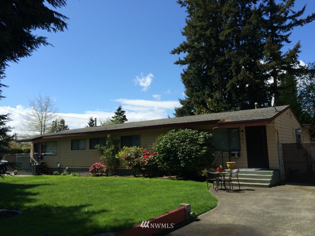 555 Index Avenue Northeast Renton, WA 98056 - Photo 1 of 1 a front view of a house with a garden