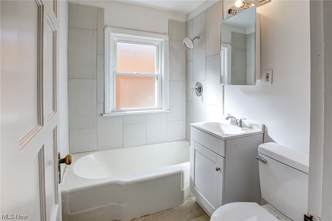 3423 Westbury Road Cleveland, OH 44120 - Photo 10 of 38 Full bathroom featuring vanity, toilet, and tiled shower / bath