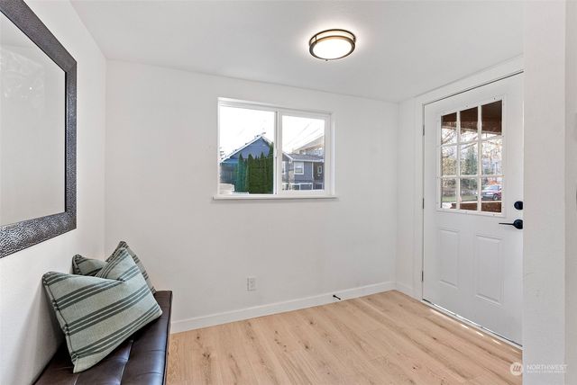 a view of room with window and hallway