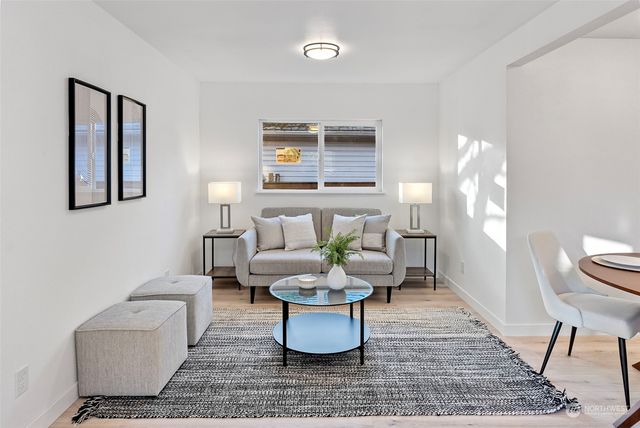 a living room with furniture and a rug