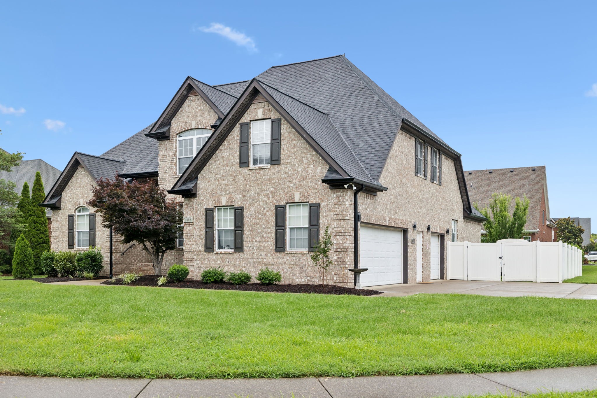 3002 Stow Crossing Murfreesboro, TN 37128 - Photo 2 of 75 a front view of a house with a garden